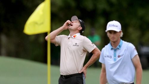Justin Rose reacts to a missed eagle putt on the eighth hole during the third round of the Masters at Augusta National Golf Club on Saturday, April 10, 2021, in Augusta. Also pictured is Will Zalatoris. Curtis Compton/ccompton@ajc.com
