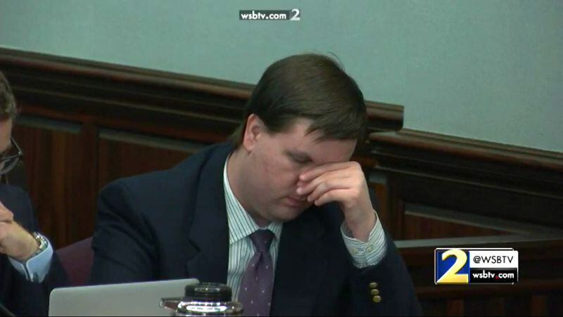 Justin Ross Harris reacts to hearing an audio recording of his ex-wife Leanna Taylor being interviewed by Cobb police on the day that Cooper died. The audio was played during the testimony of detective Ed Stockinger during Harris' murder trial at the Glynn County Courthouse in Brunswick, Ga., on Friday, Nov. 4, 2016. (screen capture via WSB-TV)