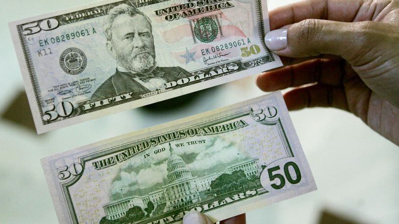 A Colorado teacher received two $50 bills from a stranger during her second job as a grocery store clerk.