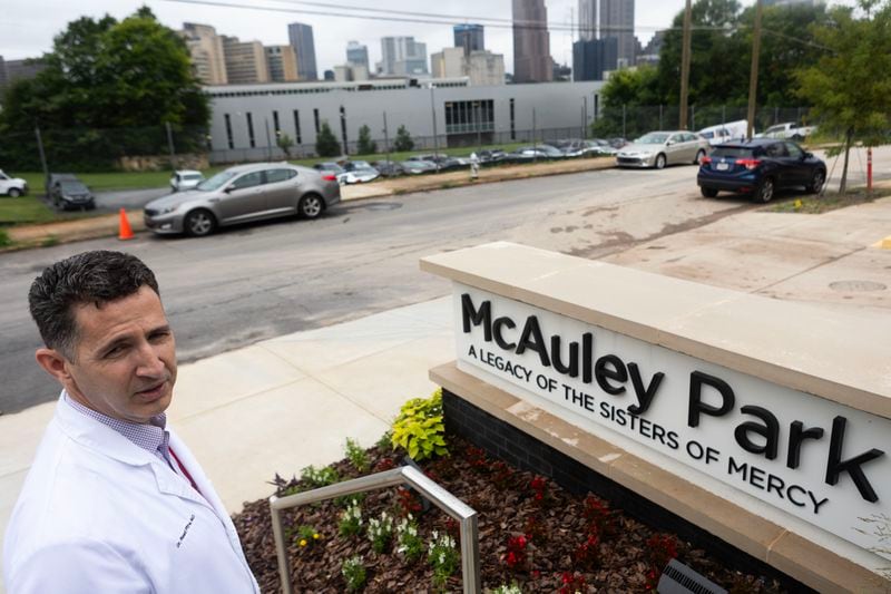 Dr. Reed Pitre shows the location were he helped a patient who lived in his car for years before being convinced to receiving care on Thursday, June 22, 2023 at Mercy Care in Atlanta. He works with patients in need. His speciality is psychiatry. Dr. Pitre has dedicated his time working with low income patients, including the homeless. (Michael Blackshire/The Atlanta Journal-Constitution)
