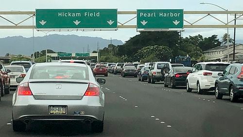 Traffic backs up at the main gates after a shooting at Pearl Harbor Naval shipyard, Wednesday, Dec. 4, 2019, near Pearl Harbor in Honolulu.