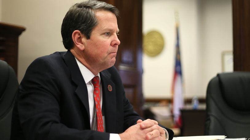 Georgia Secretary of State Brian Kemp in a staff meeting at his office in the Capitol. BOB ANDRES / BANDRES@AJC.COM