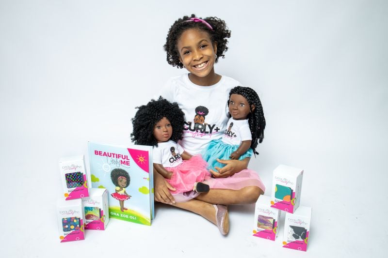 9-year-old Zoe Oli is the face behind a growing business called Beautiful Curly Me, which creates Black dolls with curly and braided hair.