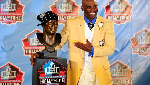 CANTON, OH - AUGUST 6:  Former Atlanta Falcons  and Florida State cornerback Deion Sanders poses with his bust at the Enshrinement Ceremony for the Pro Football Hall of Fame on August 6, 2011 in Canton, Ohio.  (Photo by Jason Miller/Getty Images)