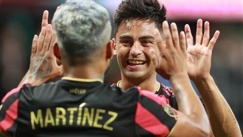 August 11, 2019 Atlanta: Atlanta United forward Josef Martinez gets a double high five from Pity Martinez after his first of two goals against New York City FC in their soccer match on Sunday, August 11, 2019, in Atlanta.   Curtis Compton/ccompton@ajc.com
