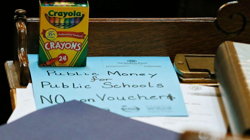 March 7, 2019 - Atlanta -  The teacher lobby  arranged to put anti-school-voucher props on every desk: boxes of crayons with a slogan scrawled on colored paper. The legislature was in session for "crossover" day, the 28th day of the 2019 General Assembly.   Bob Andres / bandres@ajc.com