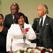 FILE -Bettersten Wade speaks to the attendees of her son Dexter Wade's funeral service in Jackson, Miss. Monday, Nov. 20, 2023. Looking on are the Rev. Al Sharpton, right, who delivered the eulogy, civil rights attorney Ben Crump, background, and one of her son's daughters, Jaselyn Thomas. Bettersten Wade, a woman who sued Mississippi's capital city over the death of her brother has decided to reject a settlement after officials publicly disclosed how much the city would pay his survivors, her attorney said Wednesday. (AP Photo/Rogelio V. Solis, File)