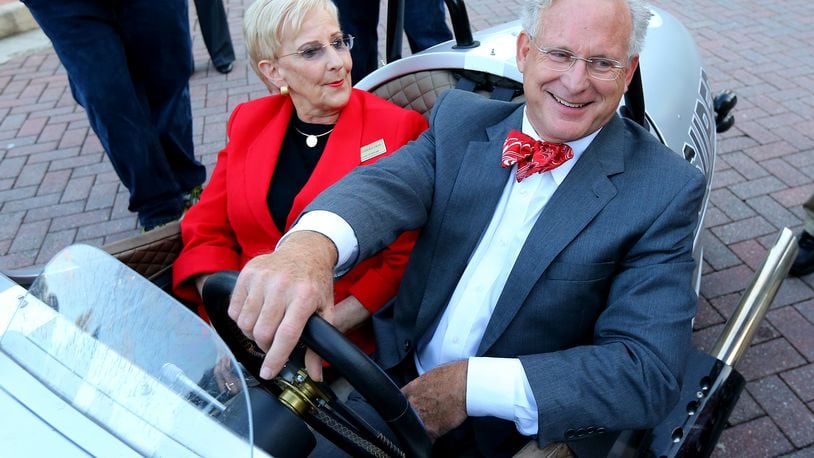 First Lady of Georgia Sandra Deal catches a ride with Roswell Mayor Jere Wood in his 3-wheel Morgan to another nearby campaign stop after her husband Georgia Governor Nathan Deal makes campaign stop with New Jersey Governor Chris Christie at Roswell City Hall on Thursday, Oct. 16, 2014, in Roswell. (CURTIS COMPTON / CCOMPTON@AJC.COM AJC File Photo)