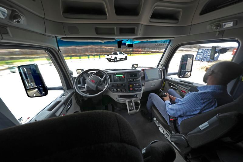 The interior of the cab of a self driving truck is shown as the truck maneuvers around a test track in Pittsburgh, Thursday, March 14, 2024. The truck is owned by Pittsburgh-based Aurora Innovation Inc. Late this year, Aurora plans to start hauling freight on Interstate 45 between the Dallas and Houston areas with 20 driverless trucks. (AP Photo/Gene J. Puskar)