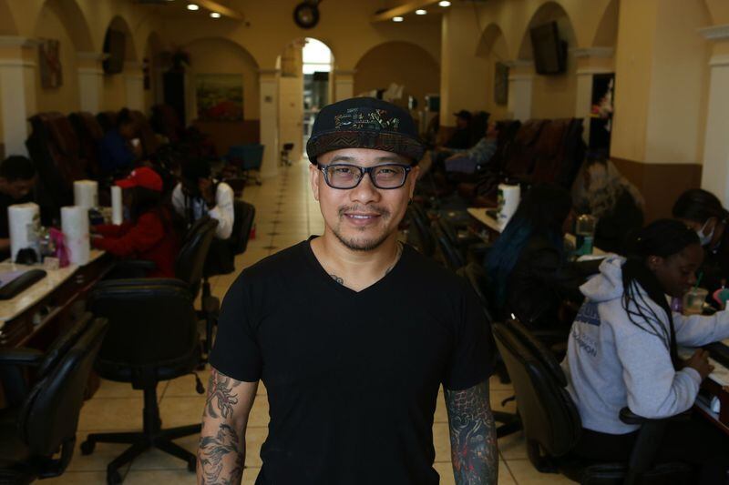 Alex Dang, owner of All Star Nail, at his shop in Atlanta in January. (Henry Taylor / henry.taylor@ajc.com)