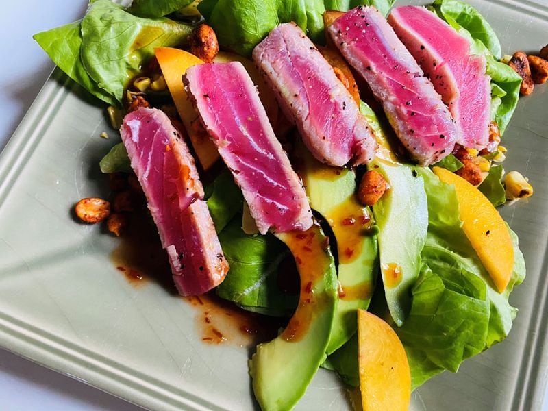 Bold Monk's yellowfin tuna salad features bibb lettuce, chile-orange vinaigrette, charred corn, peach, avocado and spicy peanuts. Bob Townsend for The Atlanta Journal-Constitution