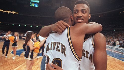 Brian Oliver and Dennis Scott embrace after their Georgia Tech team defeated Minnesota to win the 1990 Southeast Regional final and advance to the Final Four. (AJC file photo)