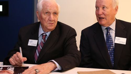 Gil Brandt, left, former Dallas Cowboys vice president of player personnel, signs autographs with former Cowboys defensive back Cliff Harris during the 2015 Texas Sports Hall of Fame induction class news conference, Thursday, April 9, 2015, in Waco, Texas. (AP Photo/Waco Tribune Herald, Rod Aydelotte)