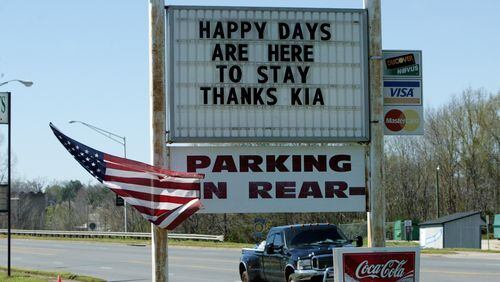West Point, GA -- The sign in front of Roger's Bar-B-Que restaurant in West Point, Ga., on March 21, 2006, upon the announcement that automaker Kia of South Korea would build a $1.2 billion plant there. AJC file