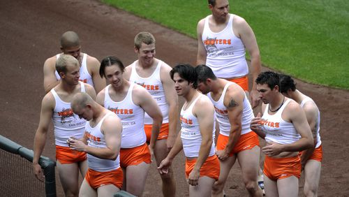Rookie members of the San Diego Padres baseball team are dressed like Hooters restaurant workers, as part of rookie hazing after the Padres' 1-0 loss to the Colorado Rockies in a baseball game at Coors Field in Denver.
