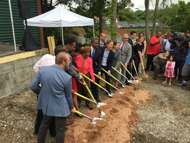 Mayor Kasim Reed joins Atlanta City Councilwoman Cleta Winslow and others in breaking ground on Monday Night Brewing's new manufacturing facility in Atlanta's West End.