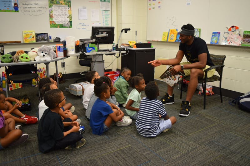 Georgia Tech guard Josh Okogie reads to rising first graders who attend the Horizons Atlanta summer learning program that supports students from underserved communities throughout their K–12 academic careers.