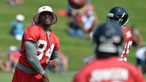HBO should dedicate one camera to Roddy White if they want some hilarious stuff. He's a funny guy. Here, White throws to fellow receiver Darius Johnson during mini-camp Tuesday June 17, 2014. BRANT SANDERLIN /BSANDERLIN@AJC.COM