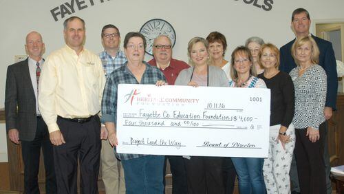 Representatives of the Heritage Community Foundation present the members of the Fayette County Education Foundation with a $4,000 grant to support the Fayette County School System’s Project Lead the Way program. Pictured (L-R) Rick Lindsey, Dan Vano, Mark Henderson, Judy Chambers, Mike Maxwell, Sheri Dockweiler, Kay Franklin, Angie Meredith, Marion Key, Roxanne Rogers, Tony Ferguson, and Debra Redding.