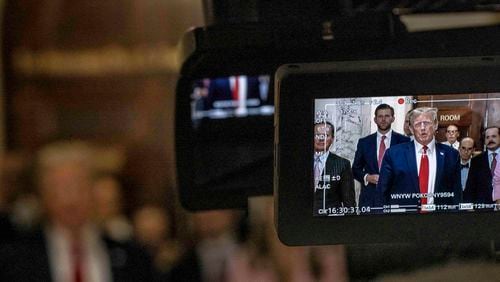 Former President Donald Trump is seen in a camera’s viewfinder as he speaks to reporters at the State Supreme Court in Manhattan on Thursday, Dec. 7, 2023. Fulton County is expected to be the only one of Trump's four criminal cases to livestream the proceedings. (Dave Sanders/The New York Times)