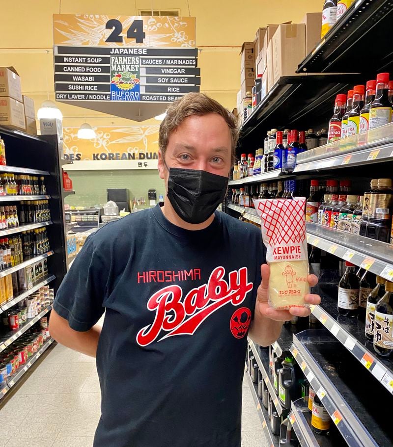 Corban Irby, the chef behind Atlanta’s popular OK Yaki pop-up, shows us where to find okonomiyaki condiments on the Japanese aisle of Buford Highway Farmers Market in Doraville. Wendell Brock/For The AJC
