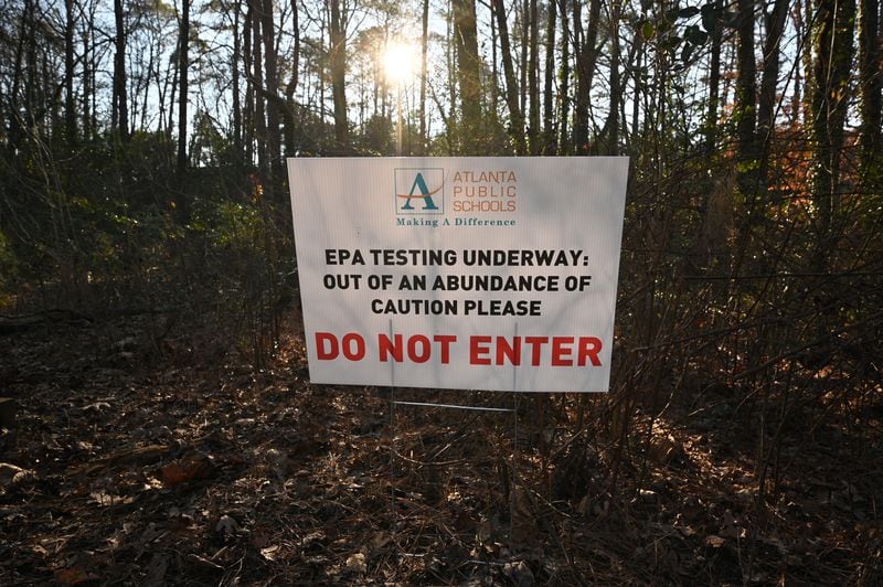 Shortly after the EPA issued its order, Atlanta Public Schools posted signs warning students and staff to stay off potentially affected parts of the Crawford Long Middle School campus. APS says that the system has also alerted parents through letters, app notices, emails, robo calls and texts. (Hyosub Shin / Hyosub.Shin@ajc.com)