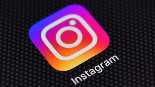 The Instagram app logo displayed on an iPhone.