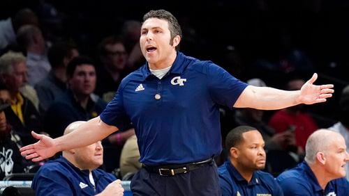 Georgia Tech coach Josh Pastner works the bench during the first half of an NCAA college basketball game against Louisville during the ACC men's tournament, Tuesday, March 8, 2022, in New York. (AP Photo/John Minchillo)