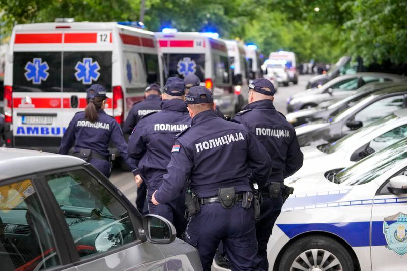 FILE - Police officers block the streets surrounding the Vladislav Ribnikar school in Belgrade, Serbia, Wednesday, May 3, 2023. A teenage boy opened fire at the school on the morning of May 3, 2023. Eight children and a school guard died, and seven people were wounded. One of the wounded, a child, died from injuries later. A total of 10 people were killed. (AP Photo/Darko Vojinovic, File)