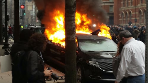 Protesters set this limo on fire. Photo: Jeff Ernsthausen