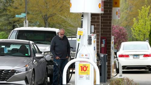 A customer fills up his vehicle's gas tank at a gas station in Buffalo Grove, Ill., Tuesday, April 23, 2024. On Tuesday, April 30, 2024, the Conference Board reports on U.S. consumer confidence for April. (AP Photo/Nam Y. Huh)