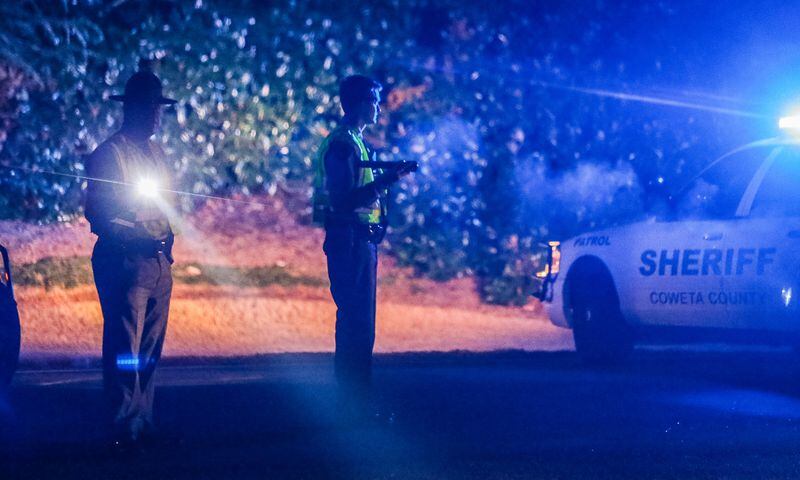 The Coweta County Sheriff's Office early Tuesday was on the scene of a deadly shootout between deputies and an armed man. JOHN SPINK / JSPINK@AJC.COM