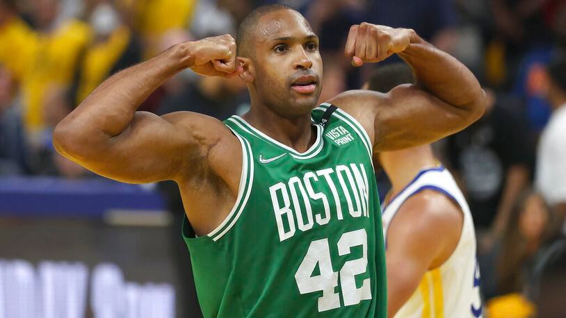 Boston Celtics center Al Horford (42) celebrates during the second half of Game 1 of basketball's NBA Finals against the Golden State Warriors in San Francisco, Thursday, June 2, 2022. The former Atlanta Hawks forward was a standout in that game. (AP Photo/Jed Jacobsohn)