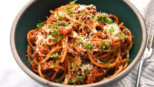 Spaghetti with Mushroom Ragu. This vegetarian dish can become vegan by simply omitting the Parmesan cheese and rind.
(CHRIS HUNT FOR THE ATLANTA JOURNAL-CONSTITUTION)