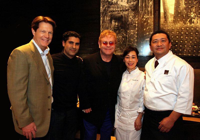 From left, Umi owners Charlie Hendon and Farshid Ashid, Sir Elton, and chefs Lisa and Fuyuhiko Ito. Photo: Sara Hanna
