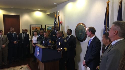 Atlanta Police Chief George Turner, Mayor Kasim Reed and others gather Thursday for announcement of Georgia Power Foundation’s $900,000 donation to city for police body armor.