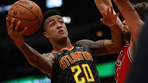 John Collins #20 of the Atlanta Hawks puts up a shot against Robin Lopez #42 of the Chicago Bulls at the United Center on October 26, 2017 in Chicago, Illinois. The Bulls defeated the Hawks 91-86.  (Photo by Jonathan Daniel/Getty Images)