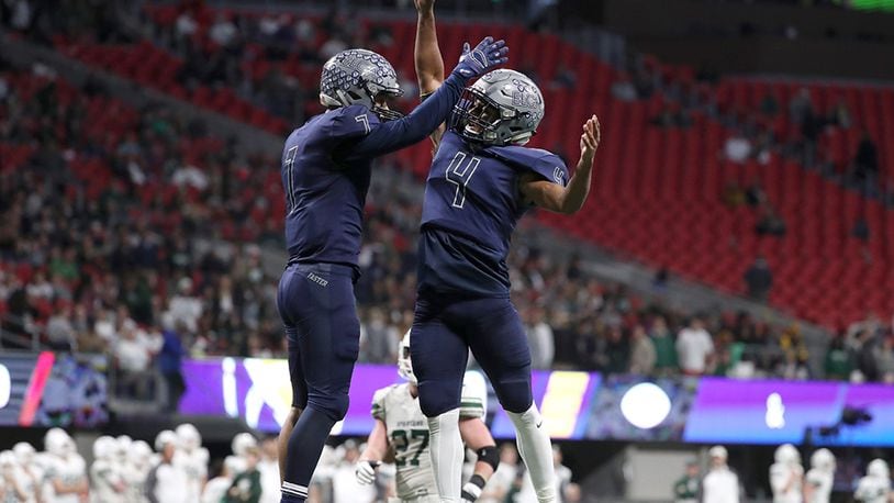 Eagle's Landing Christian wide receiver Sean Queen (7) celebrates his receiving touchdown with quarterback Nate McCollum (4) in the second half of the Class A Private Championship against Athens Academy Friday, Dec. 8, 2017,  at Mercedes-Benz Stadium in Atlanta.