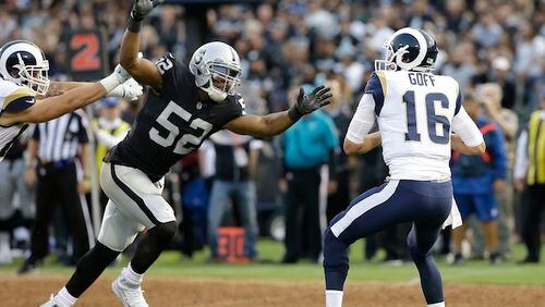 This Aug. 19, 2017, file photo shows Oakland Raiders defensive end Khalil Mack (52) sacking Los Angeles Rams quarterback Jared Goff (16) during the first half of an NFL preseason football game in Oakland.  (AP Photo/Rich Pedroncelli, File)