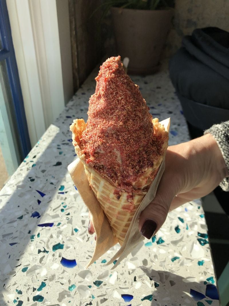 Pretty in pink: Big Softie’s waffle cone is filled with soft serve, coated with a strawberry shell and sprinkled with pink praline. Every component is made in the kitchen shared with sister establishment Little Tart Bakeshop at Summerhill. CONTRIBUTED BY WENDELL BROCK