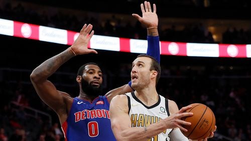 Miles Plumlee of the Atlanta Hawks drives against Andre Drummond of the Detroit Pistons at State Farm Arena on November 9, 2018 in Atlanta, Georgia.
