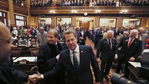 Gov. Brian Kemp is greeted by General Assembly and court members as he enters the House chamber on Thursday, Jan. 17, 2019. Kemp delivered his first State of the State address and released his first budget. BOB ANDRES / BANDRES@AJC.COM