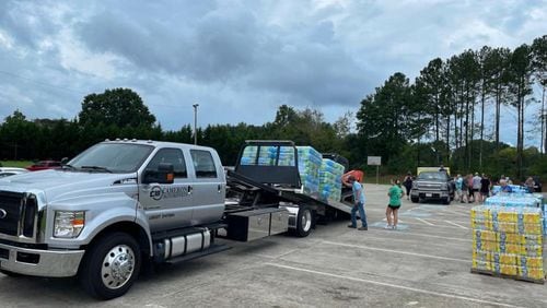 Volunteers with Rome GA Cares loaded water onto trucks headed to Summerville, GA following heavy flooding in the area. (Courtesy of Rome GA Cares)