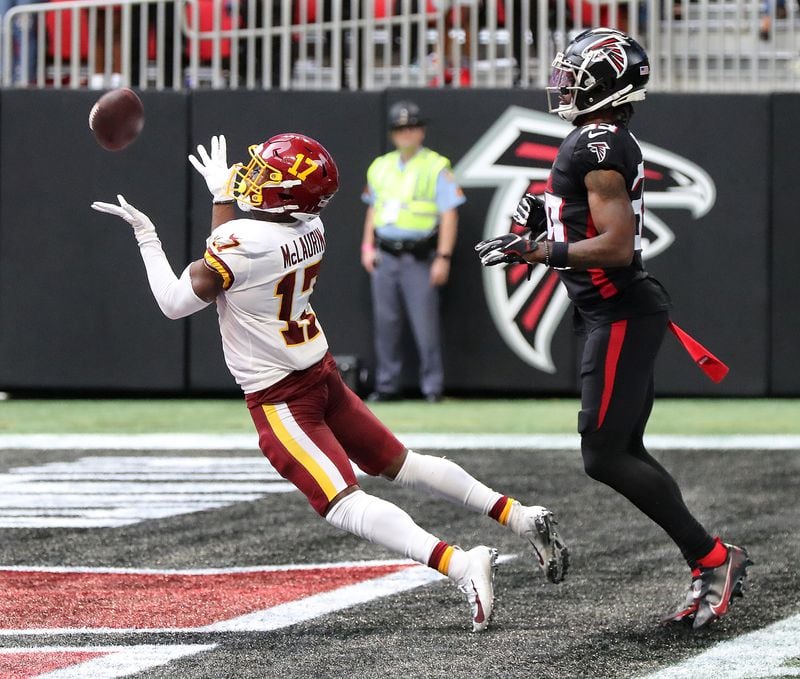 Washington Football Team wide receiver Terry McLaurin catches a touchdown pass in front of Falcons defensive back T.J. Green during the fourth quarter Sunday, Oct. 3, 2021, at Mercedes-Benz Stadium in Atlanta. (Curtis Compton / Curtis.Compton@ajc.com)