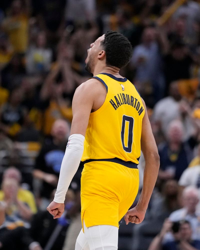 Indiana Pacers' Tyrese Haliburton reacts after hitting a 3-point shot during the second half of Game 4 of the first round NBA playoff basketball series against the Milwaukee Bucks, Sunday, April 28, 2024, in Indianapolis. (AP Photo/Michael Conroy)