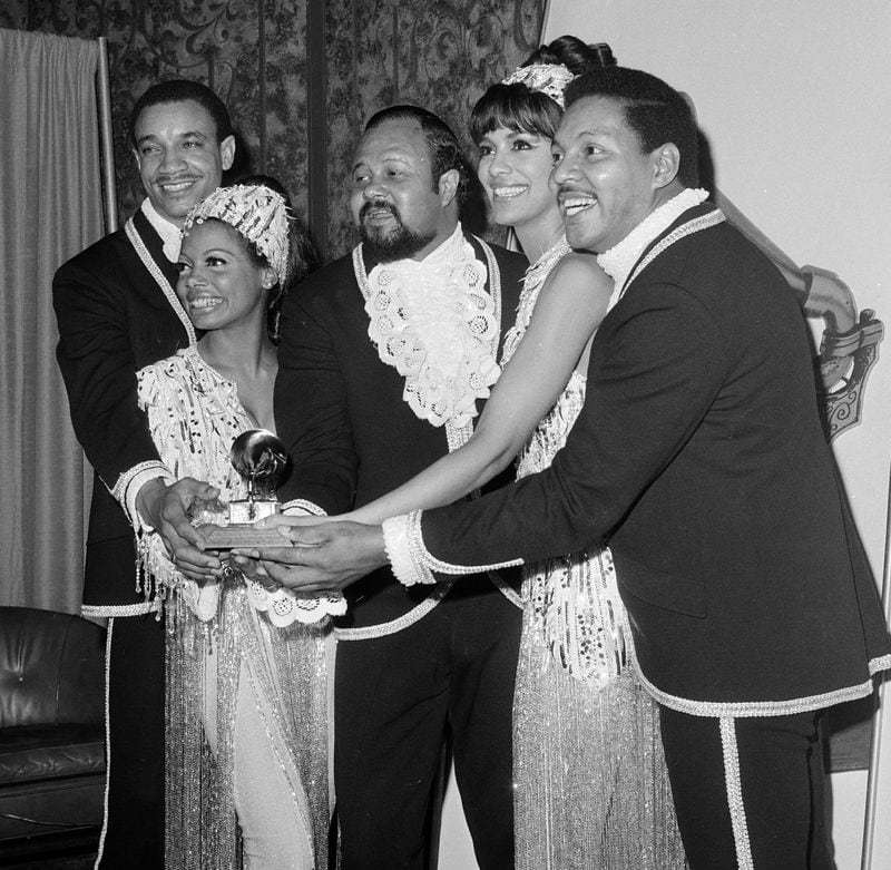 Members of the Fifth Dimension hold their Grammy in Hollywood, Feb. 29, 1968.  From left to right: LaMonte McLemore, Florence LaRue, Ron Townson, Marilyn McCoo, and Billy Davis, Jr.  (AP Photo/Harold P. Matosian)