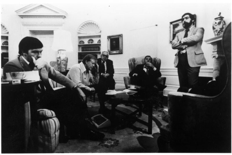 Jimmy Carter and aides in the Oval Office on the eve of Ronald Reagan's inauguration, awaiting news of the hostages in Tehran.