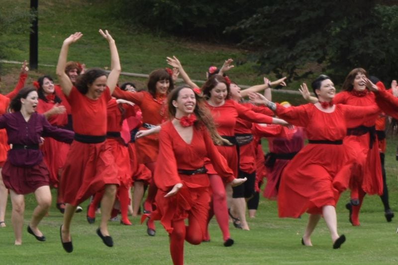 Fans of British musician Kate Bush gathered in cities all over the world today to re-enact the video for her 1978 hit "Wuthering Heights." In the original video, Bush wore a black-belted red dress and dance in a field. Fans are recreating that in Sydney, Berlin, Atlanta and many other places today. Here's what it looked like in Atlanta's Candler Park. Photo by Shane Harrison/sharrison@ajc.com