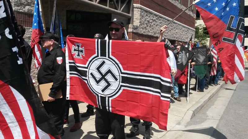 About 80 supporters of the neo-Nazi National Socialist Movement, most dressed in black military-style garb, gathered in Rome, Ga., in April 2016. Matt Kempner / AJC file