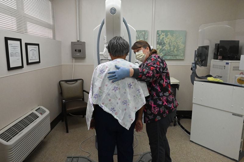 Shannon Burch, mammography technician, talks to a patient before a mammogram at Miller County Hospital. One industry observer says that preventative care is a good way for rural hospitals to find a niche in serving their community. (Hyosub Shin / Hyosub.Shin@ajc.com)
